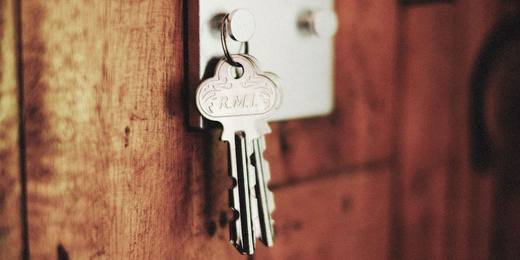 A house key in a front door lock